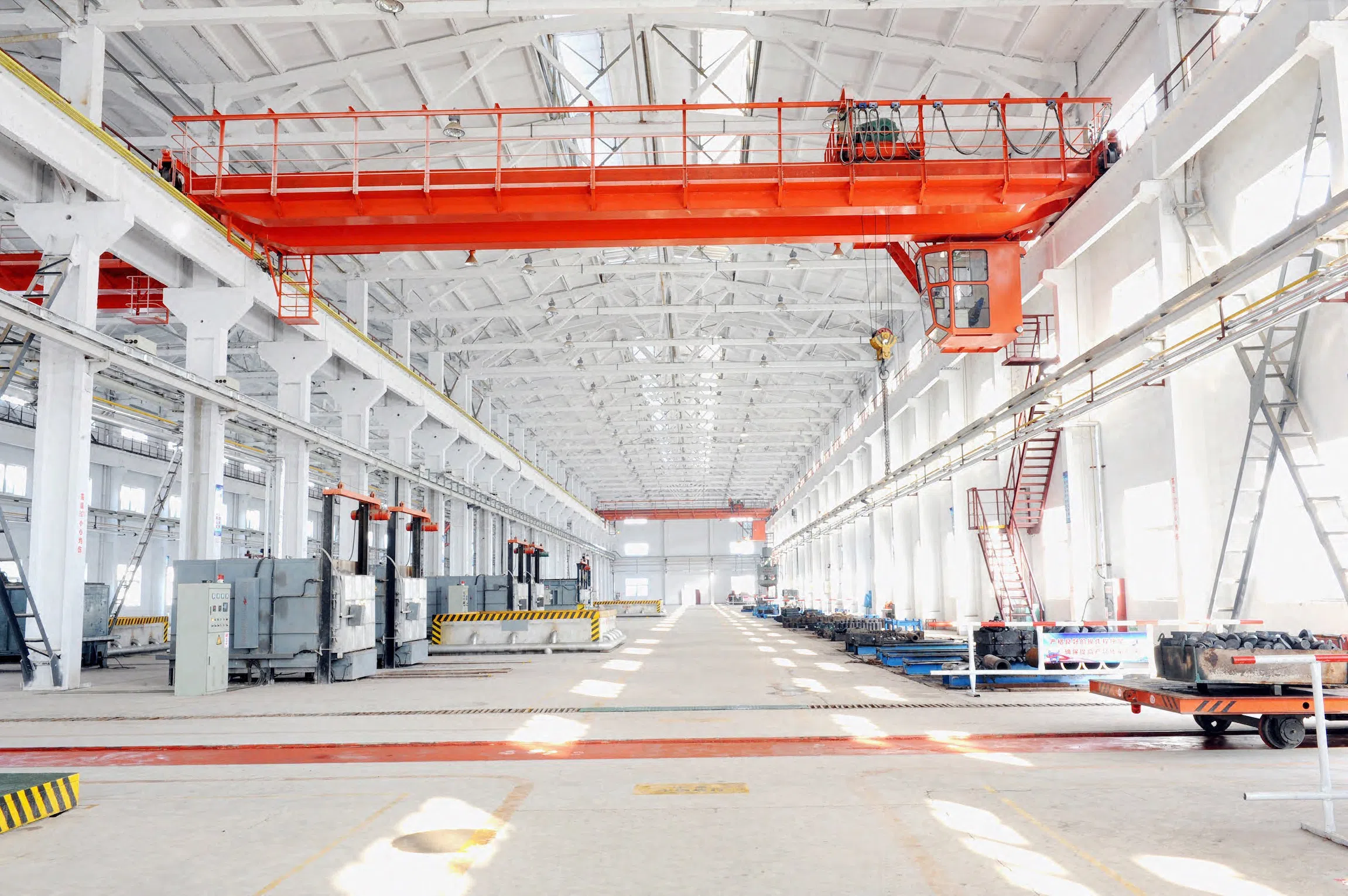 Photo Showing a Warehouse with a Large Bridge Crane Installation.